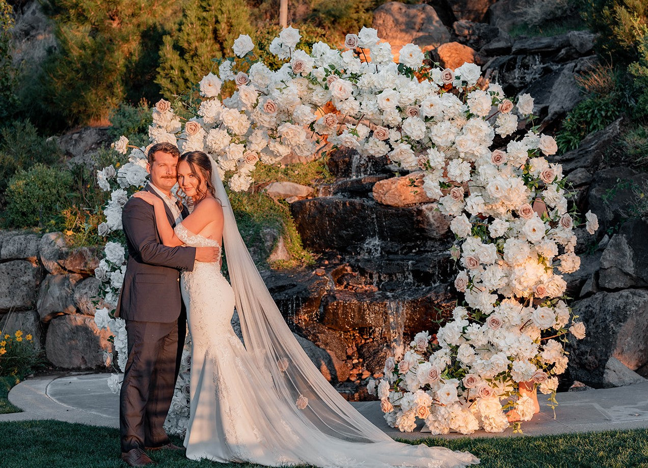 Wedding White Flower Circle Arch with Bride and Groom at Sunset 